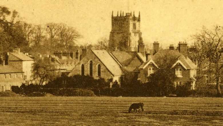 an old postcard photograph of a rural church in a little village